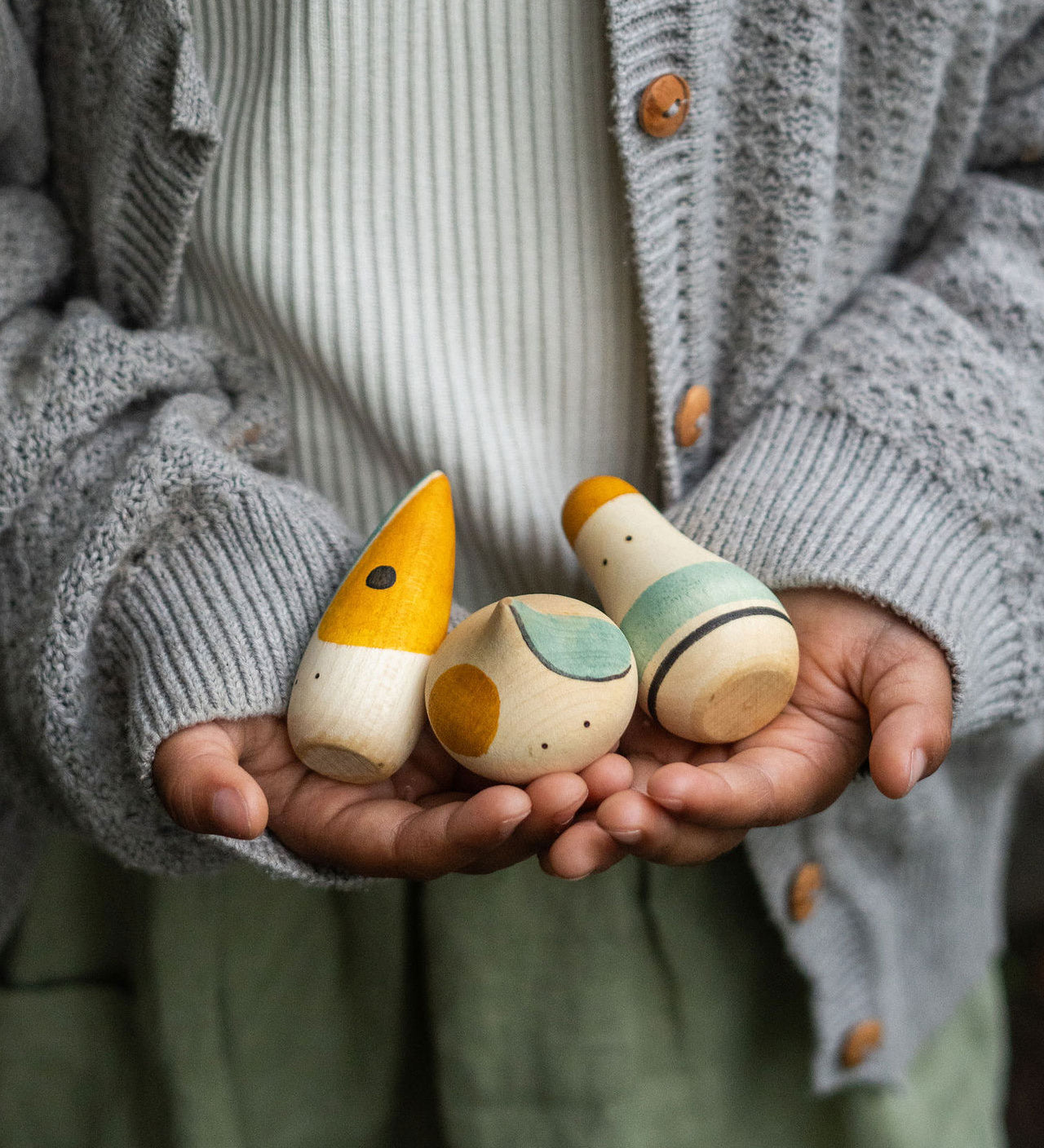 A close up of the Grapat Hooray! Set shown in a child's hands.