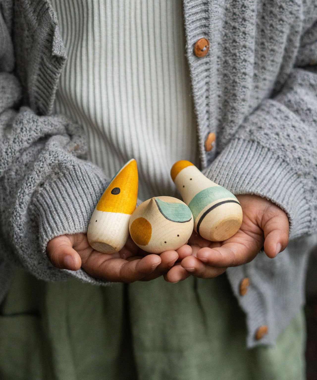 A close up of the Grapat Hooray! Set shown in a child's hands.