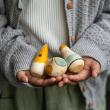 A close up of the Grapat Hooray! Set shown in a child's hands.