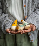A close up of the Grapat Hooray! Set shown in a child's hands.