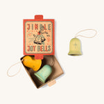 A opened red and light blue cardboard box for the Grapat wooden jingle joy bells with the light green,blue and yellow jingle joy bells inside on a cream background.
