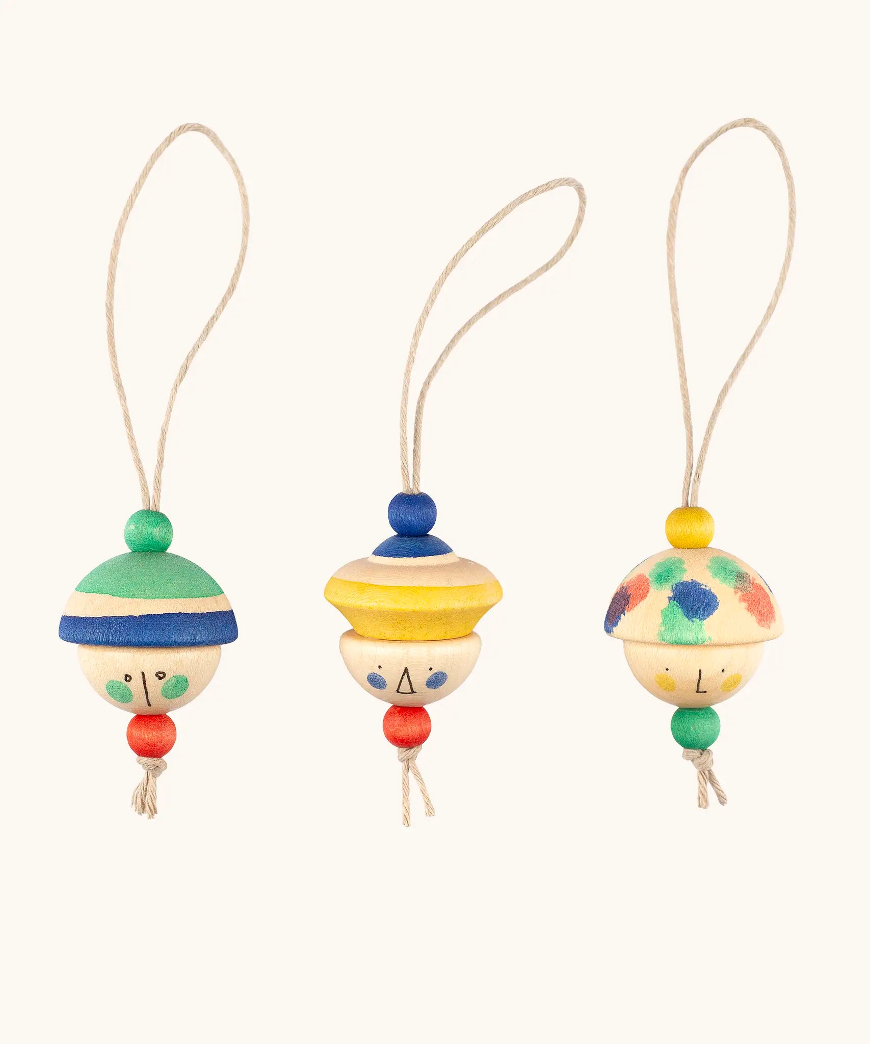 Grapat kind folk wooden Christmas ornaments hanging decorations. Three hand painted wooden decorations.