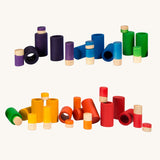 Grapat Lo wooden toy play set. A set that consists of cylinder and tubes than can be slotted in or on top of each other. These wooden toys are part of a wide range of open ended toys available at Babipur.