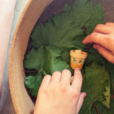 Child's hand playing with the Grapat Lucky Lucky mystery toy box number 12  little sprouts set of wooden toys. 