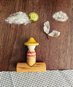 Grapat Lucky Lucky mystery toy box number 14 the fisherman set of wooden toys placed in a flatlay style small world play scene. 