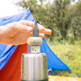 A outdoor camping setting showing the 3 space inspired wooden peg dolls and pieces from the Grapat lucky lucky boxes. Features delicate hand painted designs. 
