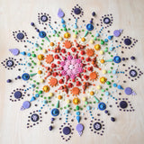 Rainbow coloured mandala created using Grapat mandala pieces.