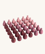 Grapat 36x Mandala Pineapples. 36 pineapple shaped mandala pieces in three shades of purple, 12 in each colour. Grapat have a wide range of wooden toys and loose parts available at Babipur. 