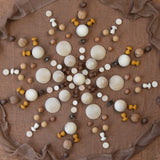 A mandala flatlay made from Grapat mini wooden mushroom pieces