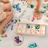 Children playing with the Grapat Mis and Match Wooden Sorting Box Play Set