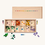 Grapat Mis and Match Wooden Sorting Box Play Set. A wooden box with 12 compartments and wooden cubes in rainbow colours.