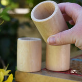 Grapat natural cup in an adult's hand.
