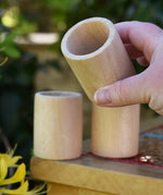 Grapat natural cup in an adult's hand.