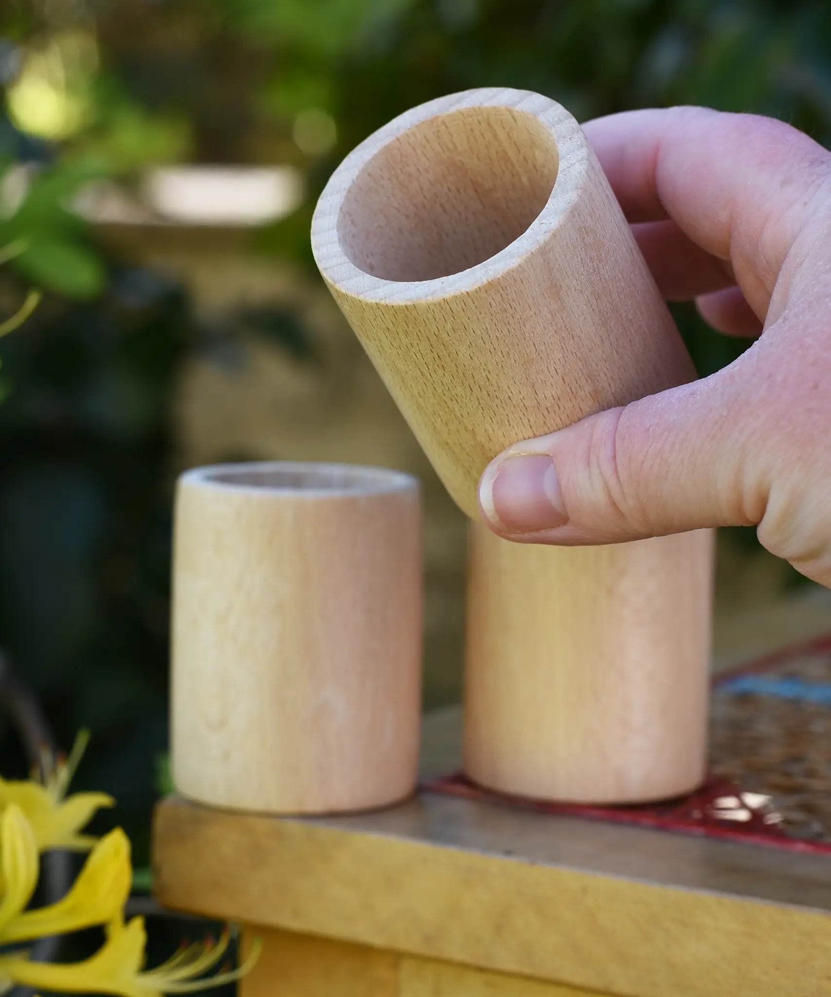 Grapat natural cup in an adult's hand.