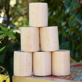 Grapat natural cups stacked up on a stool outdoors. 