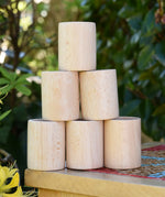 Grapat natural cups stacked up on a stool outdoors. 