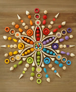 A mandala flatlay using a number of Grapat natural and coloured loose pieces