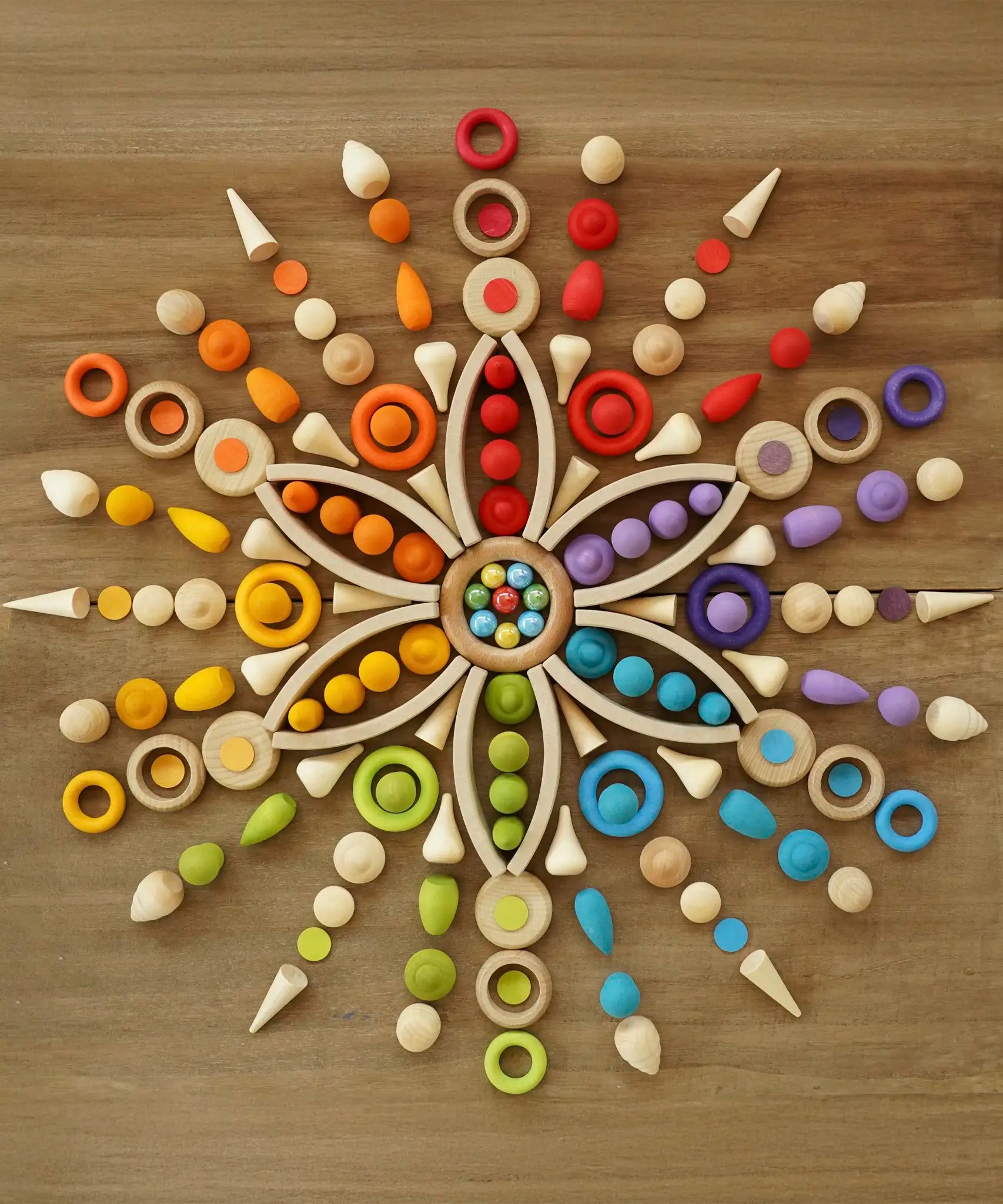 A mandala flatlay using a number of Grapat natural and coloured loose pieces
