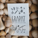 Grapat Natural Wood Mandala shown in the box with a information leaflet on top.