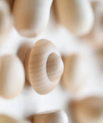 Close up of a mandala creating using the Grapat Natural Wood Mandala.