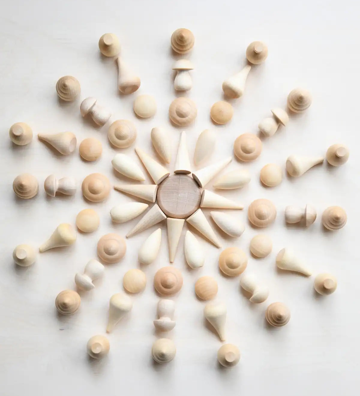 Grapat natural wooden mandala pieces used to create a mandala pattern