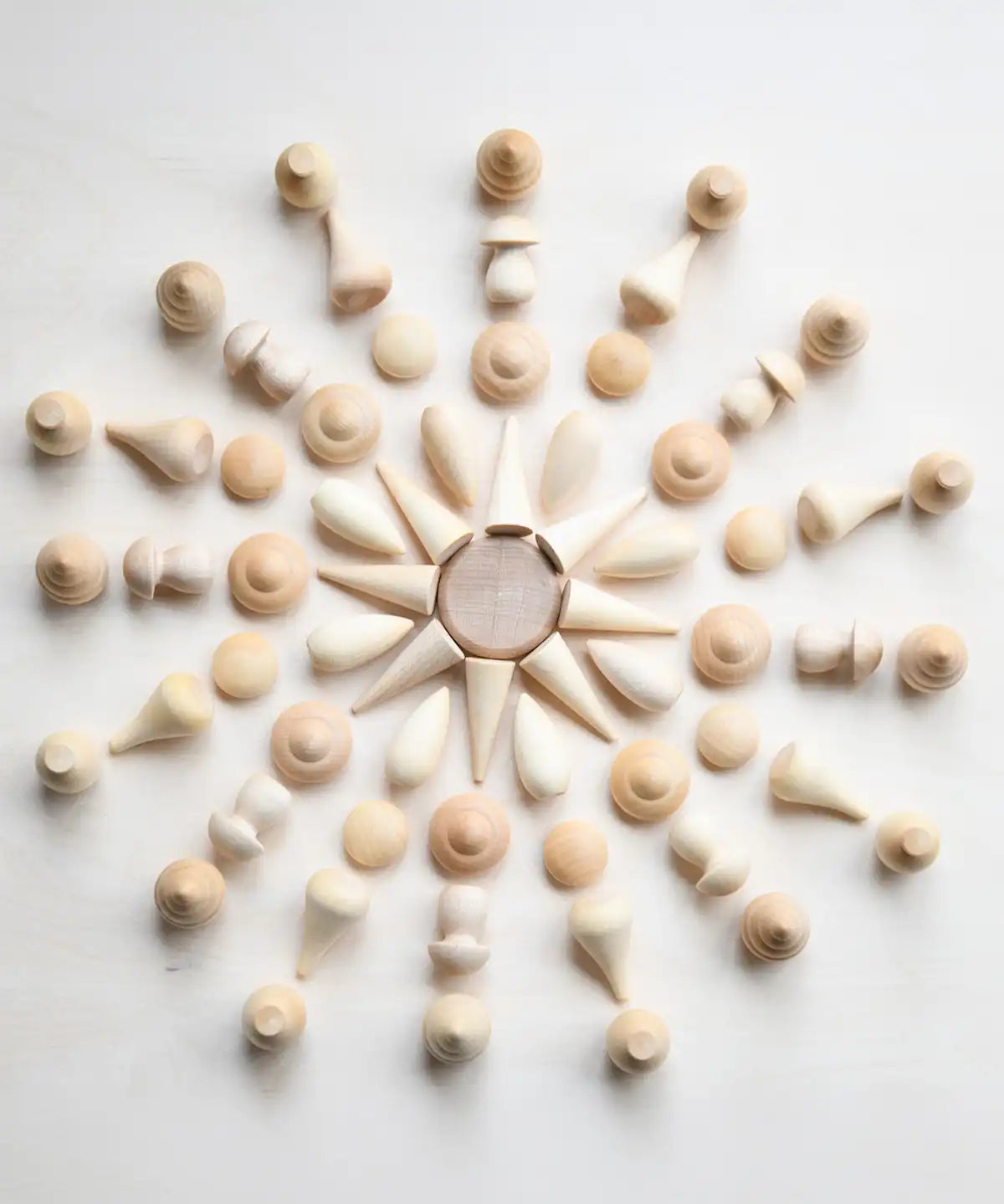 Grapat natural wooden mandala pieces used to create a mandala pattern