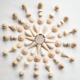 Grapat natural wooden mandala pieces used to create a mandala pattern