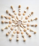 Grapat natural wooden mandala pieces used to create a mandala pattern