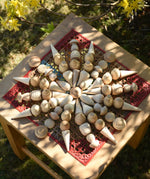 Mandala created using Grapat natural mandala pieceson a stoll outdoors.