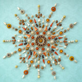 A decorative mandala flatlat using handcrafted wooden Grapat loose pieces