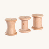 Grapat Loose Parts 3 Natural Wooden Spools. Each spool has a different size or shape of column. These spools are a part of a wide range of loose parts and wooden toys by Grapat available here at Babipur. 