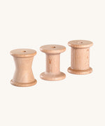 Grapat Loose Parts 3 Natural Wooden Spools. Each spool has a different size or shape of column. These spools are a part of a wide range of loose parts and wooden toys by Grapat available here at Babipur. 