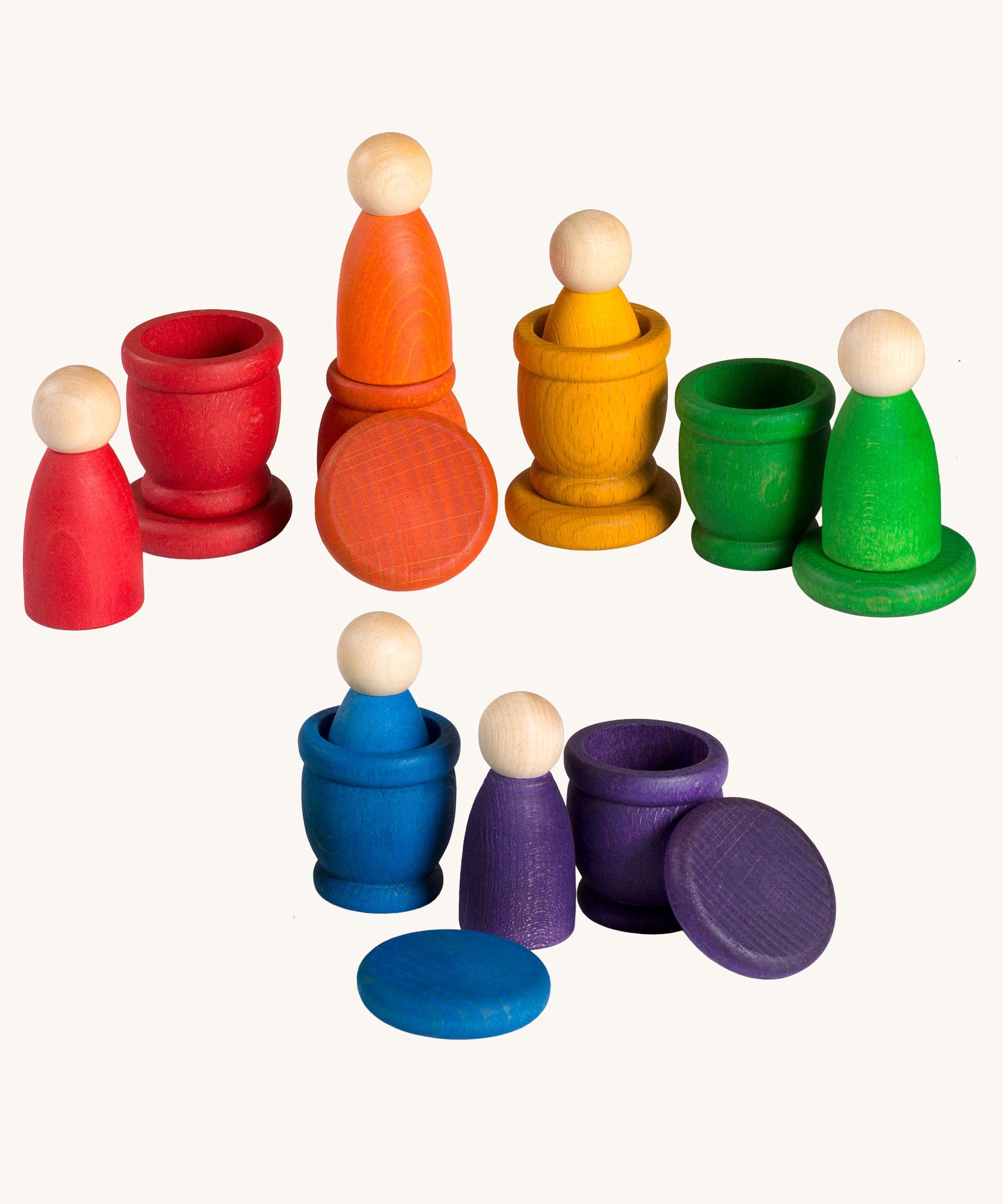 Grapat Wooden Peg Doll Nins®, Mates (Cups) and Coins in 6 rainbow colours. These wooden toys are part of a wide range of open ended toys available at Babipur.  