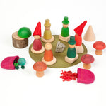 a wooden peg doll set to create a magical woodland scene. Perfect for story telling and imaginative small world play. White background.