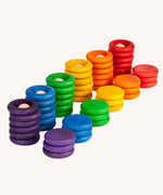 Grapat Wooden Peg Doll Nins®, Rings and Coins wooden toy play set. These wooden toys are part of a wide range of open ended toys available at Babipur.  