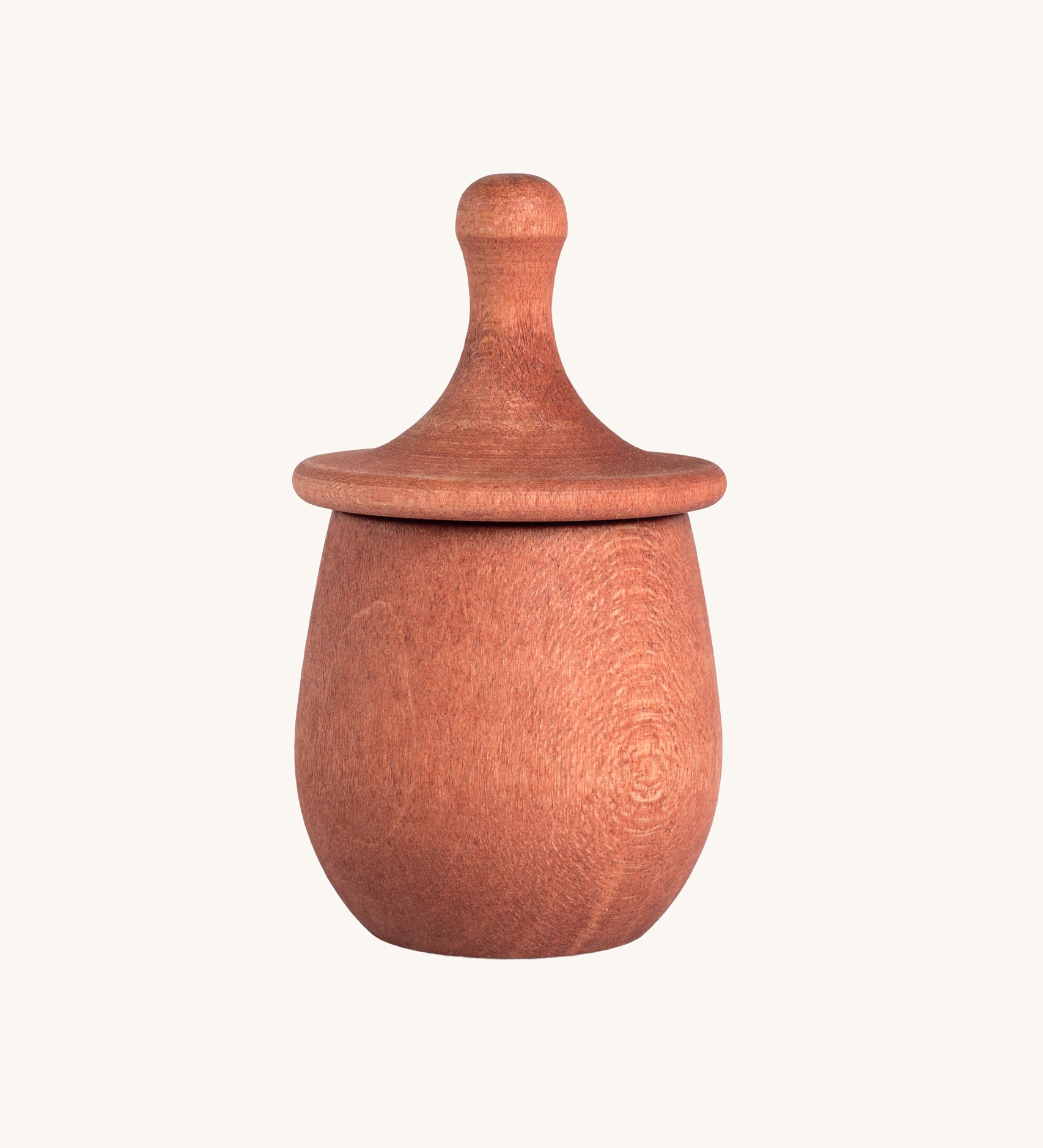 Grapat orange Little Things. A wooden top with eyes drawn on and an orange coloured pot to match. Grapat have a wide range of wooden toys and loose parts available at Babipur. 