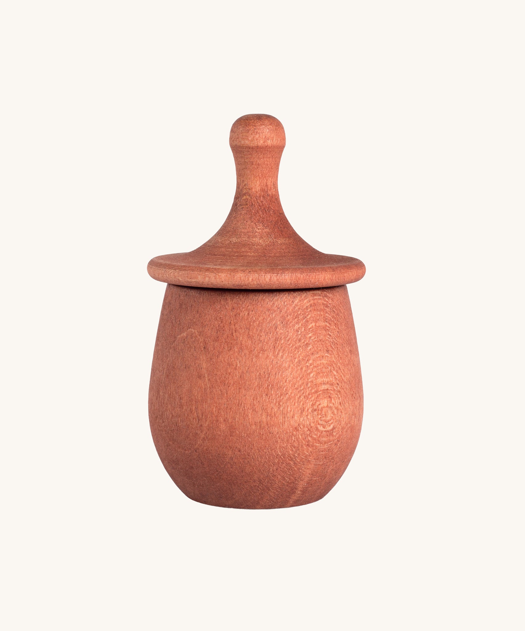 Grapat orange Little Things. A wooden top with eyes drawn on and an orange coloured pot to match. Grapat have a wide range of wooden toys and loose parts available at Babipur. 