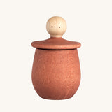 Grapat orange Little Things. A wooden top with eyes drawn on and an orange coloured pot to match. Grapat have a wide range of wooden toys and loose parts available at Babipur. 