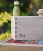Close up of the logo engraved onto the Grapat permanance box.