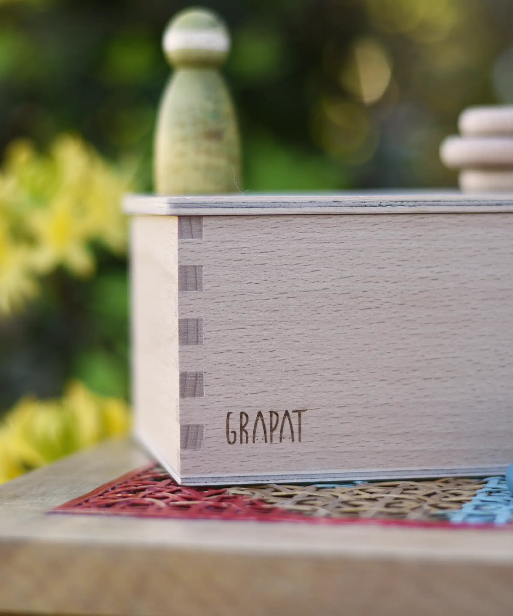 Close up of the logo engraved onto the Grapat permanance box.