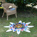 Grapat petal platform pieces laid out on grass to create a mandala with Grapat lose parts.