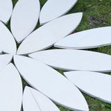 Grapat wooden petal platform placed on grass in the Babipur garden.