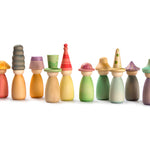 Grapat wooden Fancy Nins rainbow peg doll toys lined up on a white background