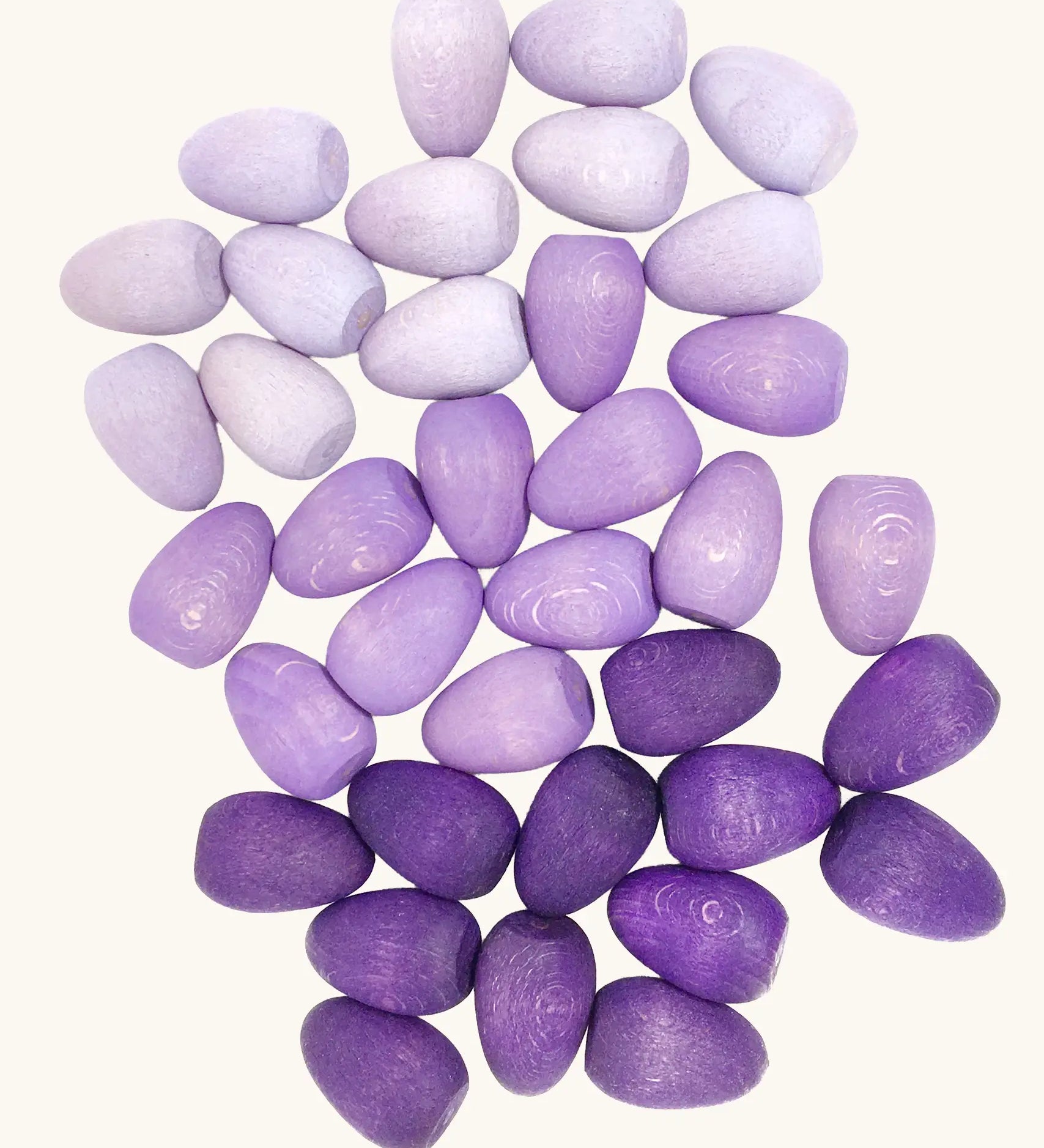 Grapat 36x Mandala Eggs.Wooden egg shaped mandala pieces in three different shades of purple. 
