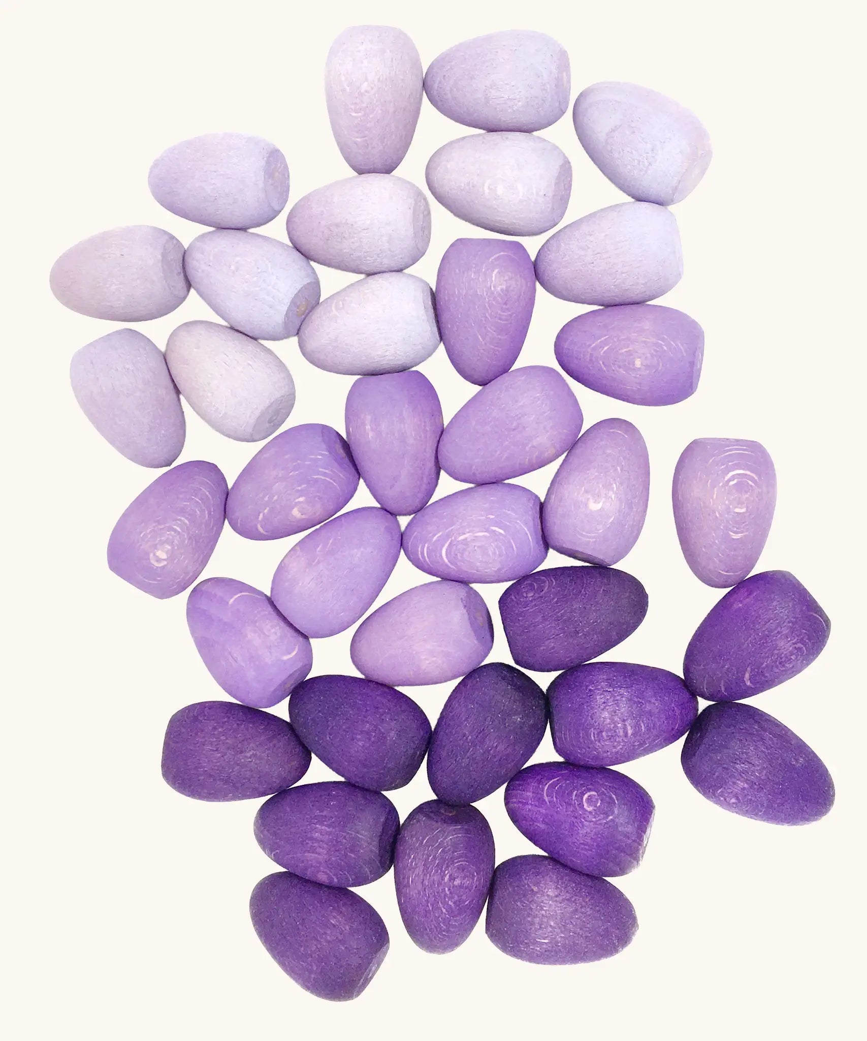 Grapat 36x Mandala Eggs.Wooden egg shaped mandala pieces in three different shades of purple. 