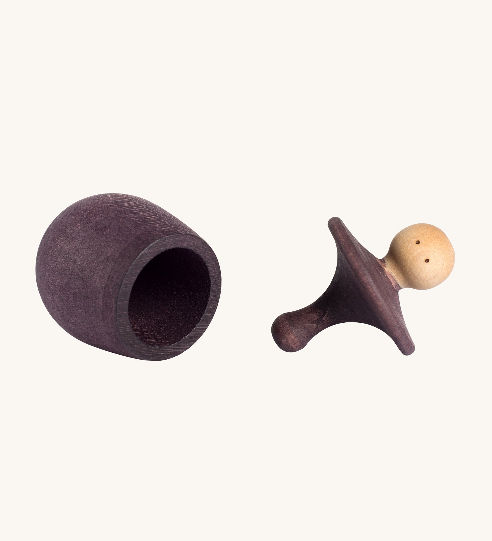 Grapat purple Little Things. A wooden top with eyes drawn on and a purple coloured pot to match. Grapat have a wide range of wooden toys and loose parts available at Babipur. 