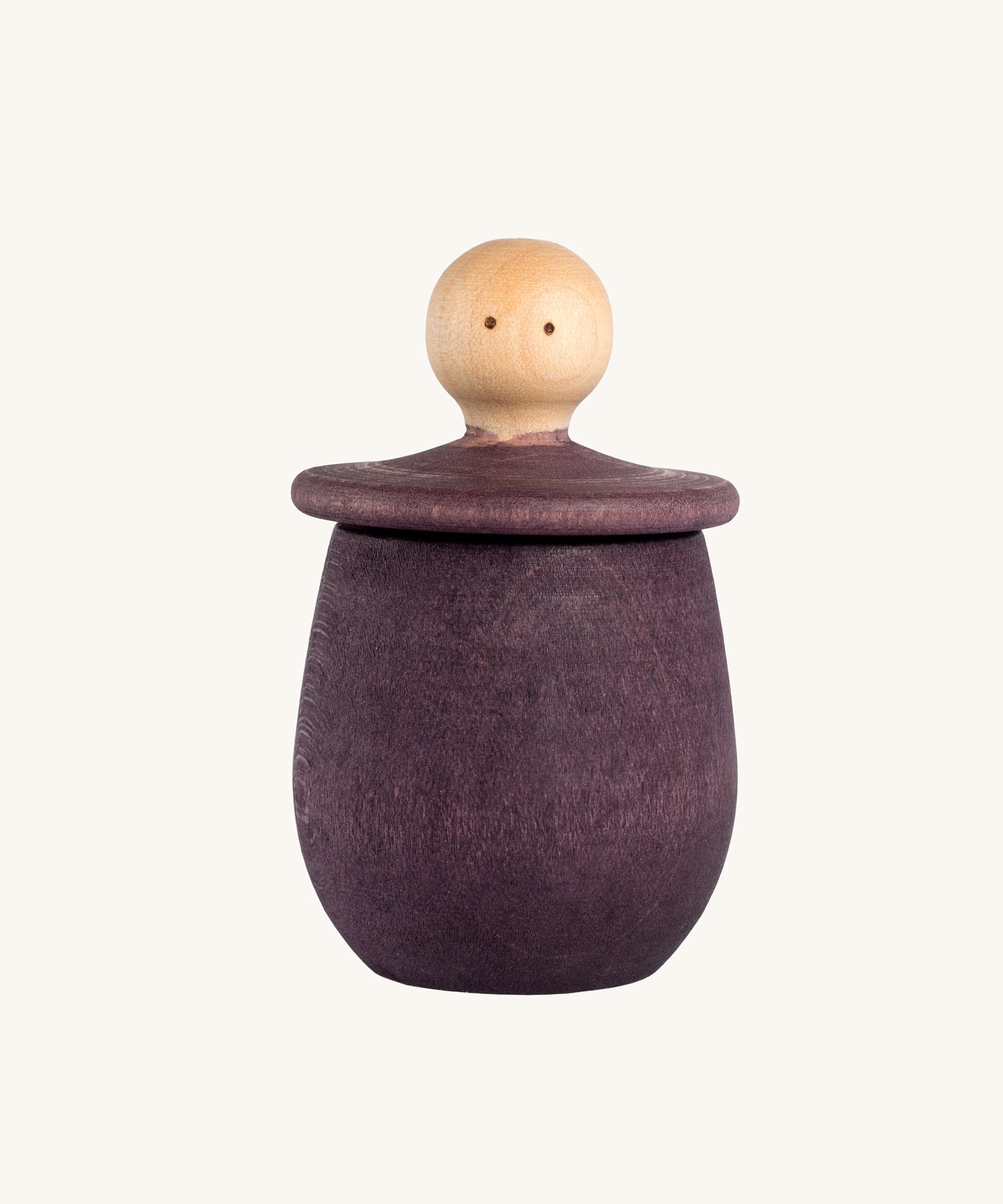 Grapat purple Little Things. A wooden top with eyes drawn on and a purple coloured pot to match. Grapat have a wide range of wooden toys and loose parts available at Babipur. 