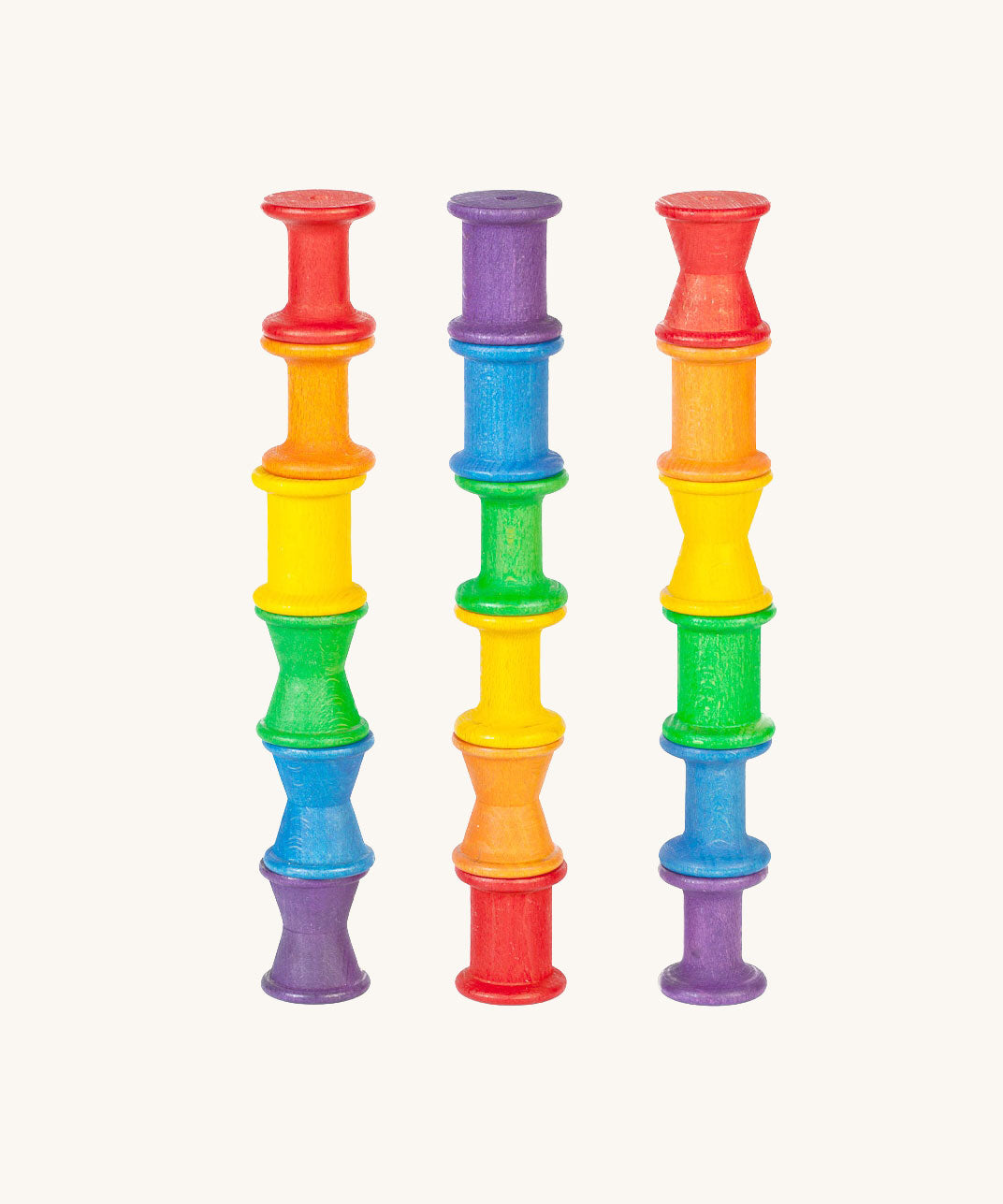 Grapat 18 Wooden rainbow coloured Spools. These wooden toys are part of a wide range of open ended toys available at Babipur.  