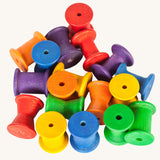 Grapat 18 Wooden rainbow coloured Spools. These wooden toys are part of a wide range of open ended toys available at Babipur.  