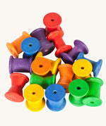 Grapat 18 Wooden rainbow coloured Spools. These wooden toys are part of a wide range of open ended toys available at Babipur.  